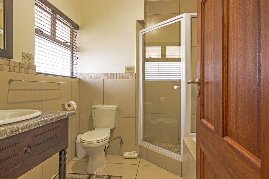 Deluxe room Bathroom with shower and bath